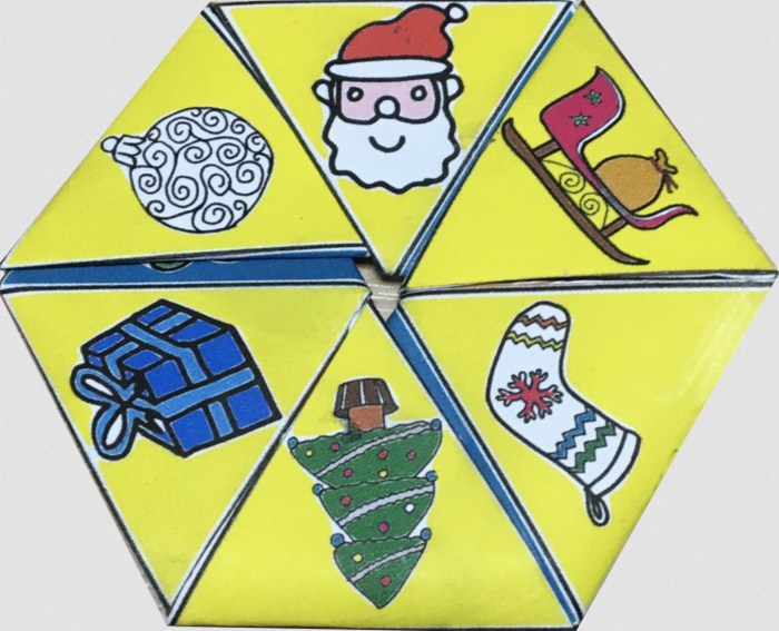 Photo of a Christmas-themed hexahexaflexagon, folded and glued into place ready to flex.